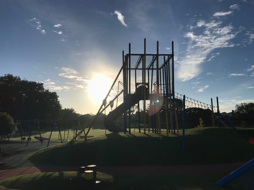 Outdoor playground at sunset